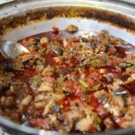 Piatto tipico del borgo, servito con ingredienti freschi e tradizionali.