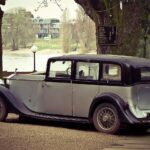 Immagine di diverse auto esenti dal bollo auto con testo informativo sull'esenzione a vita.